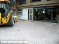 Removing existing paving stones from hotel valet parking area in Langley, BC, Canada