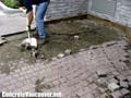 Removing existing paving stones from hotel valet parking area in Langley, BC, Canada