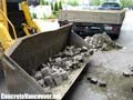 Removing existing paving stones from hotel valet parking area in Langley, BC, Canada