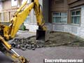 Removing existing paving stones from hotel valet parking area in Langley, BC, Canada