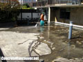 Pressure cleaning the concrete surface in North Vancouver, BC, Canada