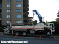 Concrete pump truck to pour concrete swimming pool deck in North Vancouver, BC, Canada