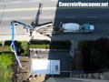 Concrete pump truck loading stamped concrete mix on pool deck in North Vancouver, BC, Canada