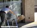 Dusting concrete with powder release for pool deck in North Vancouver, BC, Canada