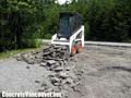 Removing badly broken asphalt driveway in Whistler, BC, Canada