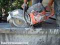 Diamond blade saw-cutting concrete wall coping in Whistler, BC, Canada