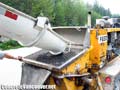 Concrete pump truck hopper being loaded with colored stamp concrete mix in Whistler, BC, Canada